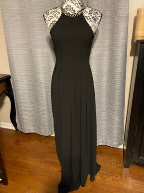 the clothing company Black Halter Maxi Dress with Beaded Neckline